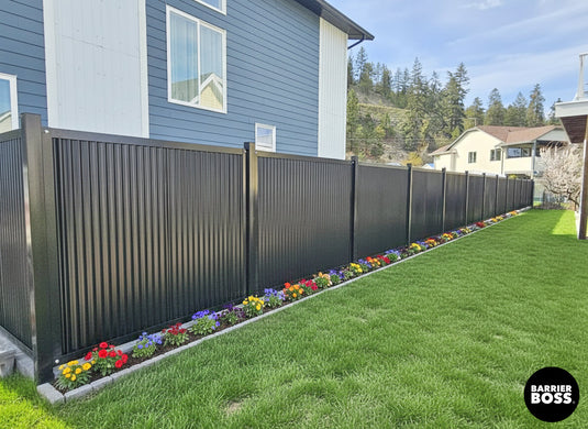Sleek FireSmart Metal Fencing in Midnight Black Installed Along Property Line of Washington Home.