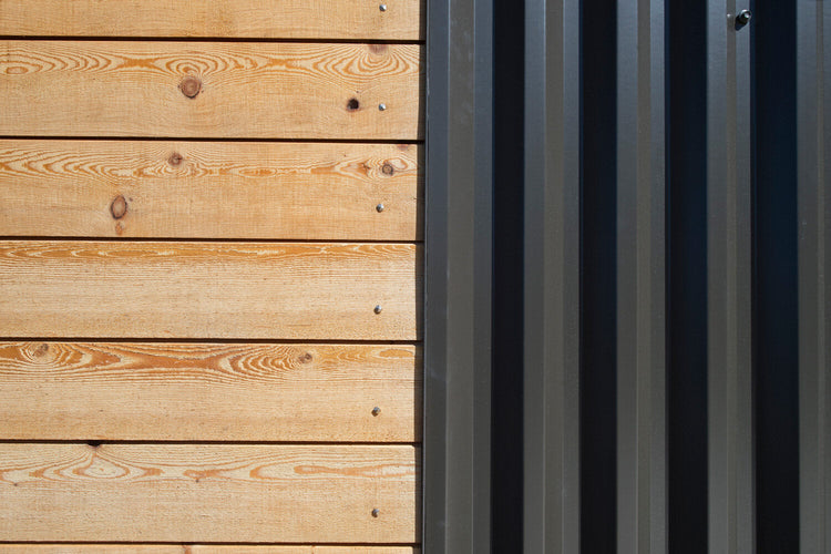 corrugated metal panels in black PVDF paint