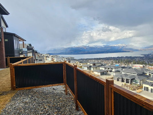 Corrugated metal privacy fence used on coastal home.