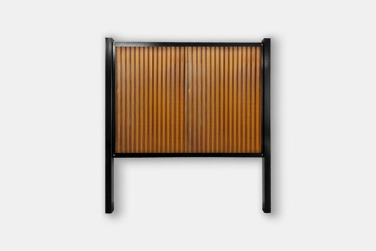 The Deep South FireSmart Metal Fence System with Matte Black Steel Posts and Corten Rust Corrugated Panel.