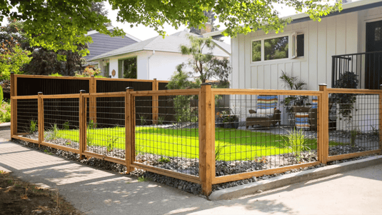 DIY Hog Wire Fencing With Black Mesh and Cedar Frame Installed Along Urban Front Yard.