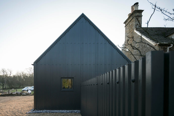 The Rise of Black Barndominiums: Embracing Corrugated Metal Roofing Elegance