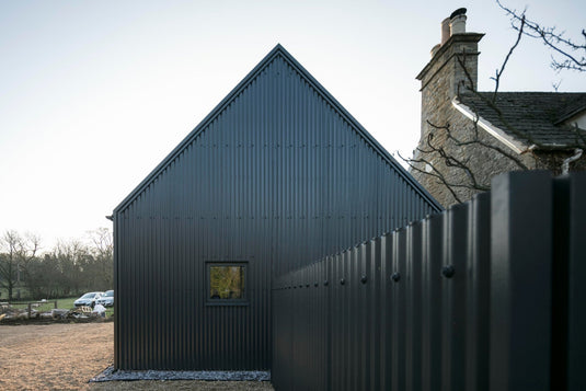 The Rise of Black Barndominiums: Embracing Corrugated Metal Roofing Elegance - BarrierBoss™