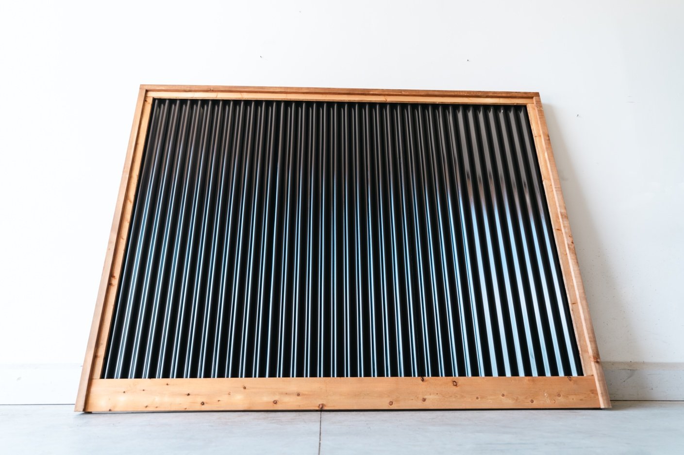 Corrugated metal fence panels, HDP NoFade privacy fence — BarrierBoss