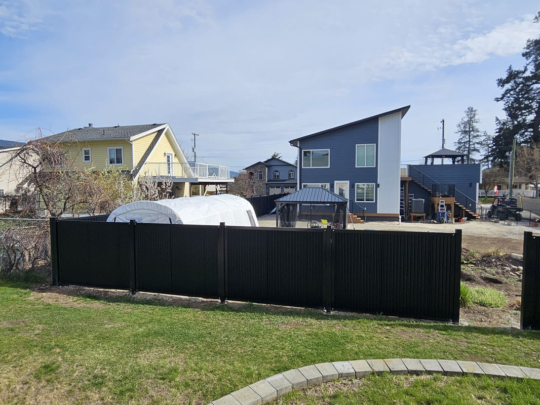 The Deep South - Corrugated Metal Fence Panels in black with Steel Post Frame System - BarrierBoss™