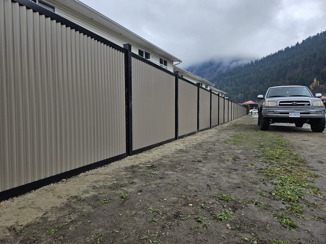 "The Deep South" corrugated metal fence in vertical orientation, framed with steel posts 