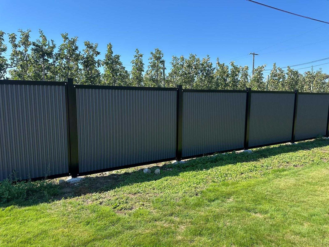 Vertical Gray Corrugated Metal Fence Panels with Steel Post Frame System - The Deep South - BarrierBoss™