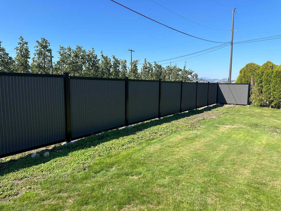 Vertical Gray Corrugated Metal Fence Panels with Black Steel Post Frame System - The Deep South - BarrierBoss™