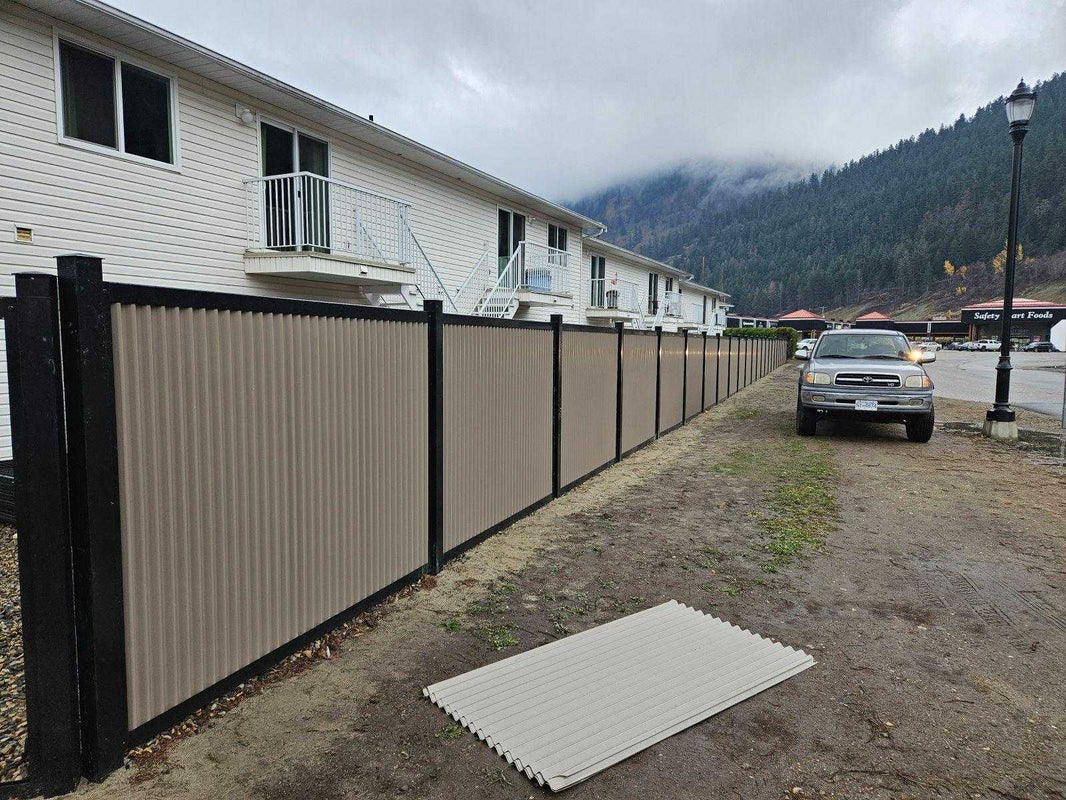 Gray Corrugated Metal Fence Panels with Steel Post Frame System - The Deep South - BarrierBoss™