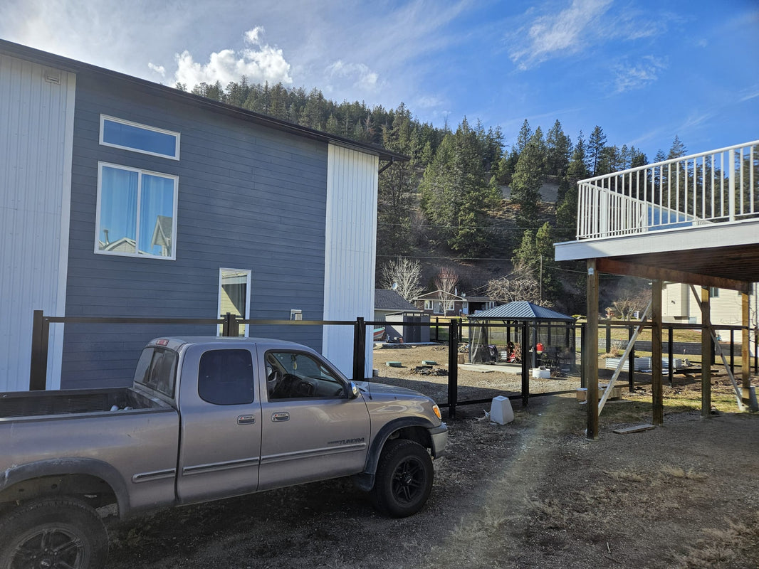 The Deep South - Forever Fence steel post frames being installed and prepped for corrugated metal fence sheets.