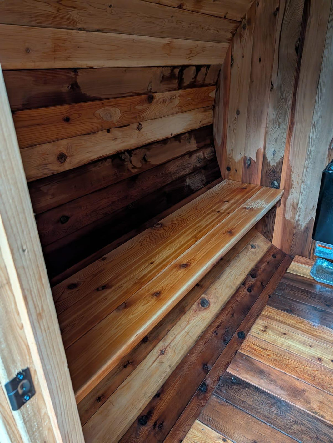 Wooden bench inside a wooden sauna