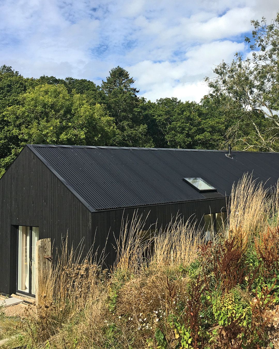 black metal building by BarrierBoss